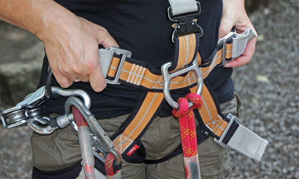 Close up of a harness put on by a man