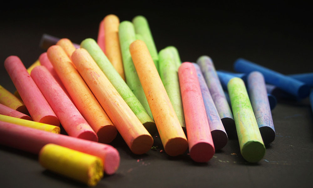 Colorful chalks on a dark background