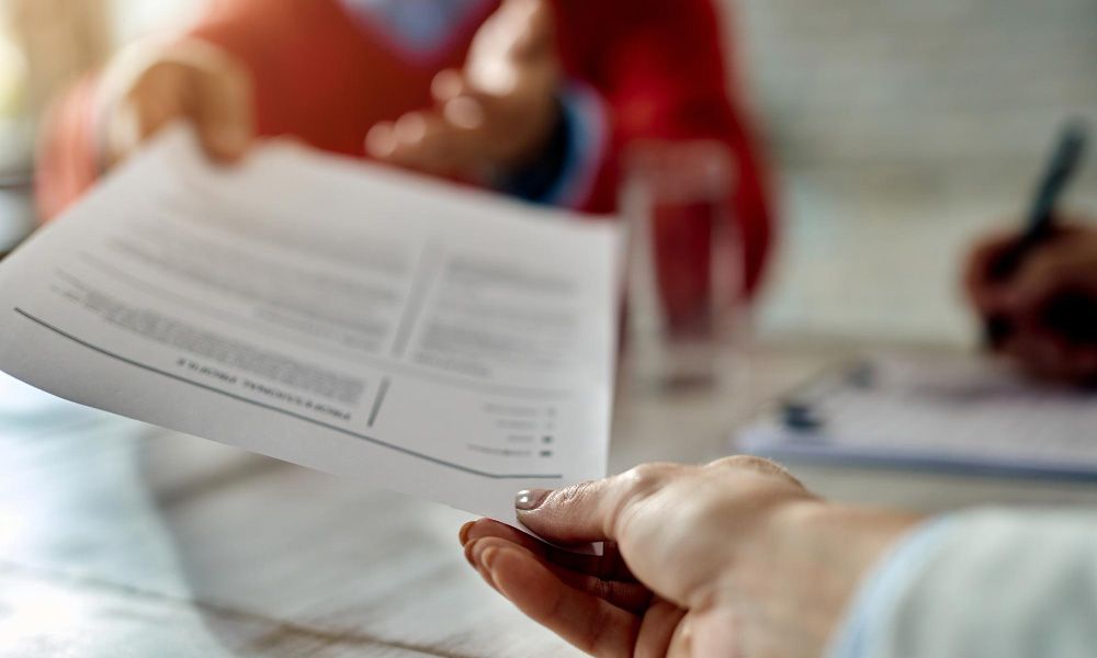 Job candidate gives his cv during the interview