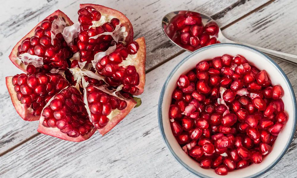 Pomegranate cut in half and placed in a bowl