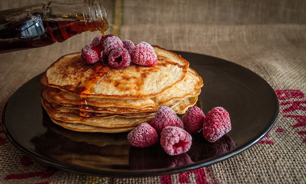 Pouring pancakes maple syrup