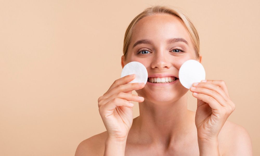 Smiling woman with cosmetic flakes