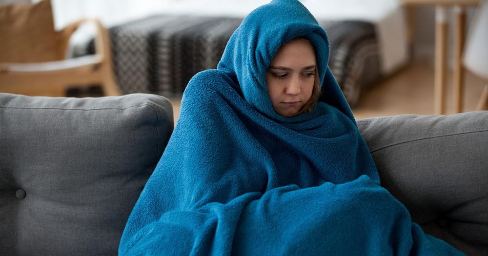 Woman wrapped in a blanket