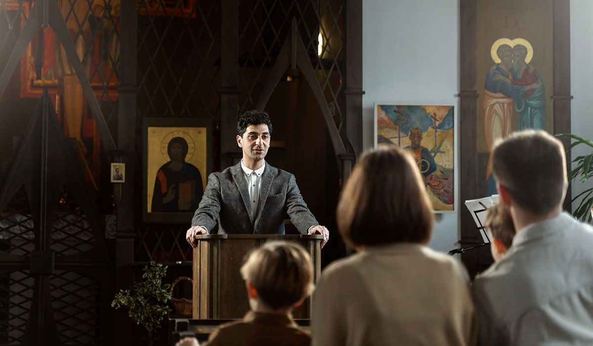 Young pastor preaching a church